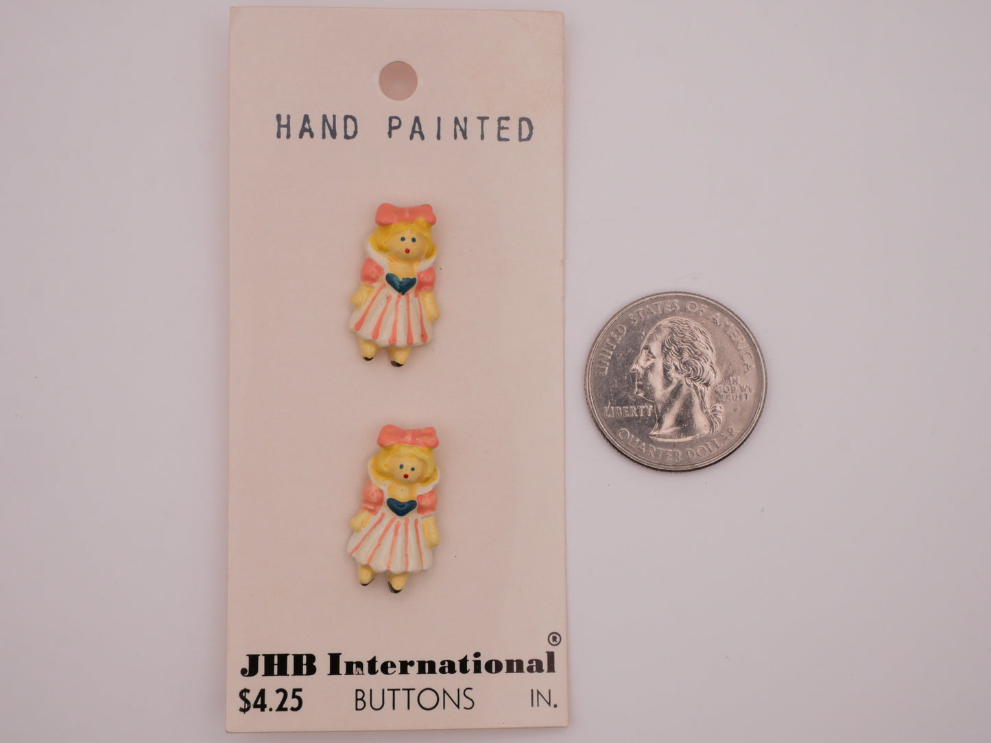 Girl Peachy Pink Bow Hand-Painted Enamel Metal JHB Carded Pair of Buttons 12x21mm