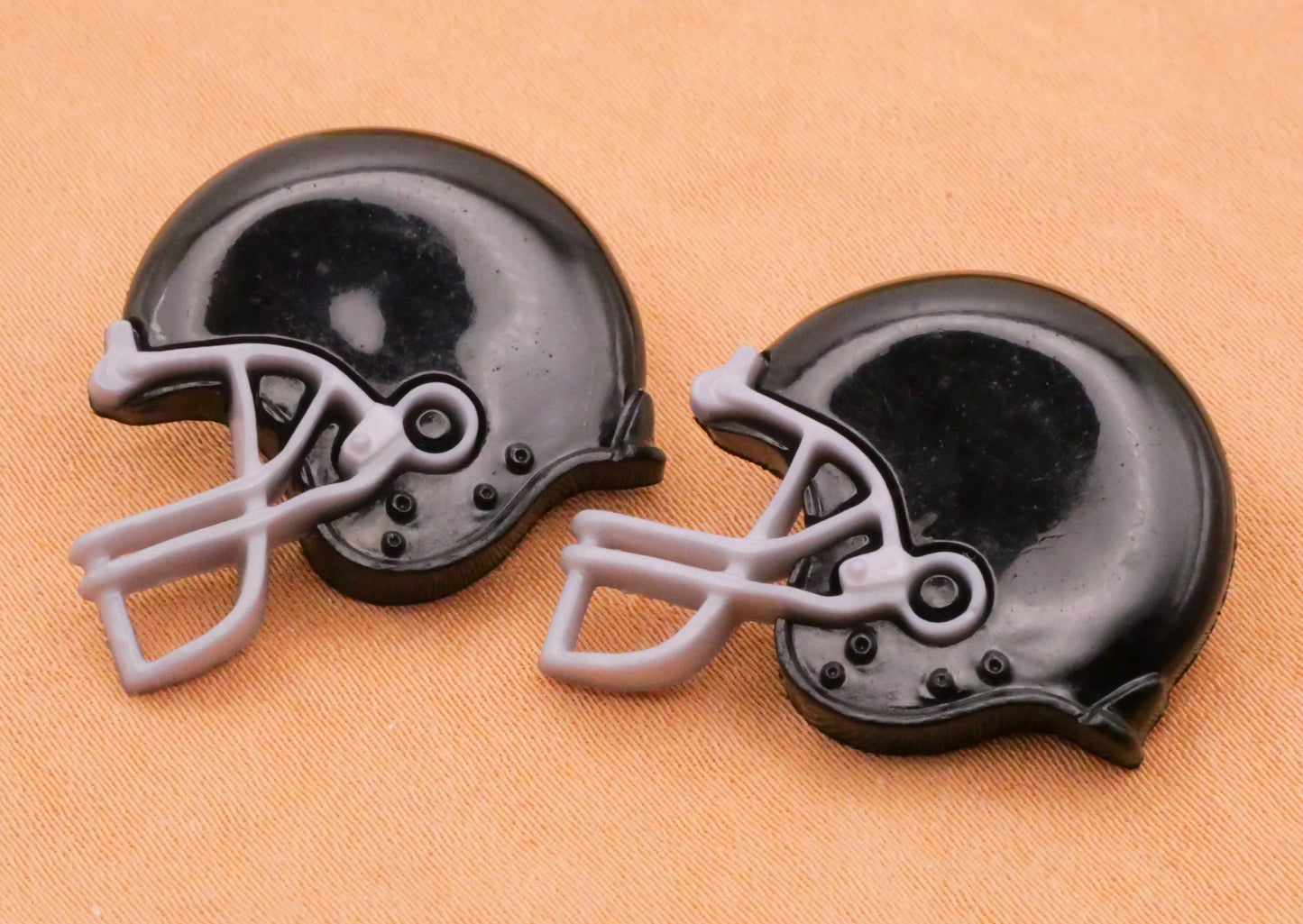 Football Helmet Black Plastic Pair of Buttons 21x24mm