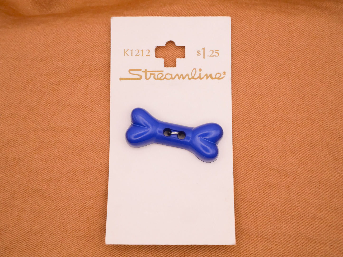 Dog Bone Blue Plastic Carded Button 14x34mm