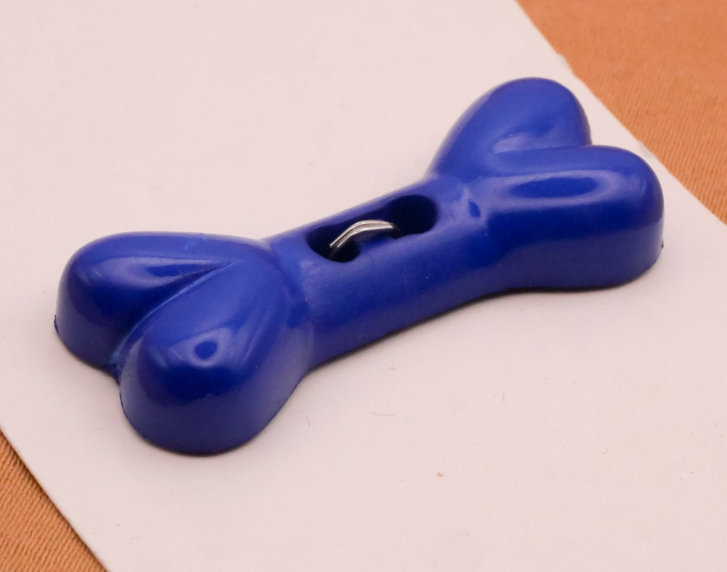Dog Bone Blue Plastic Carded Button 14x34mm