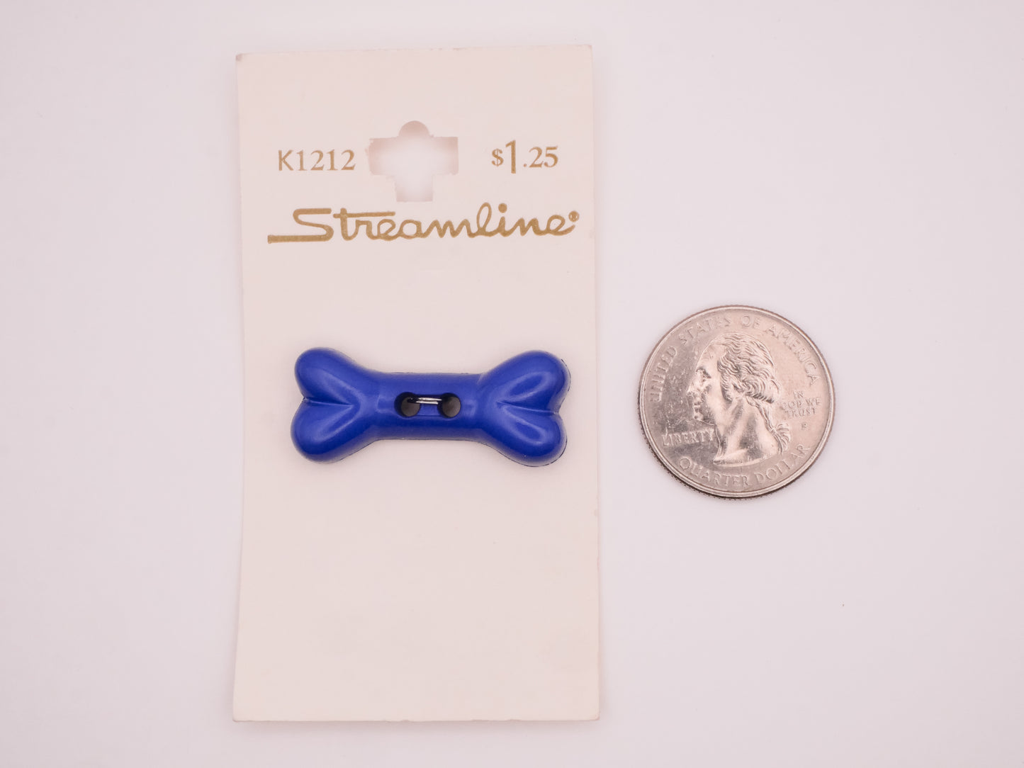Dog Bone Blue Plastic Carded Button 14x34mm
