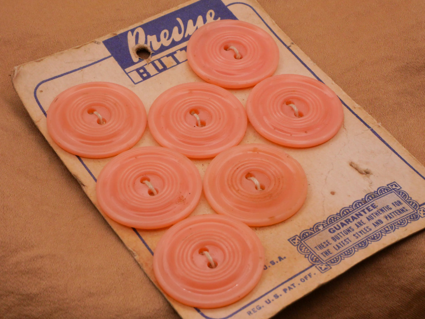 Peachy Pink Vintage Plastic Set of Seven Carded Buttons 22mm