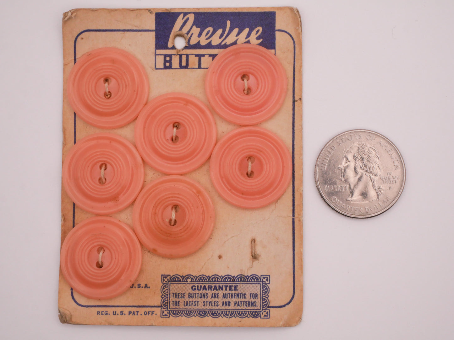 Peachy Pink Vintage Plastic Set of Seven Carded Buttons 22mm