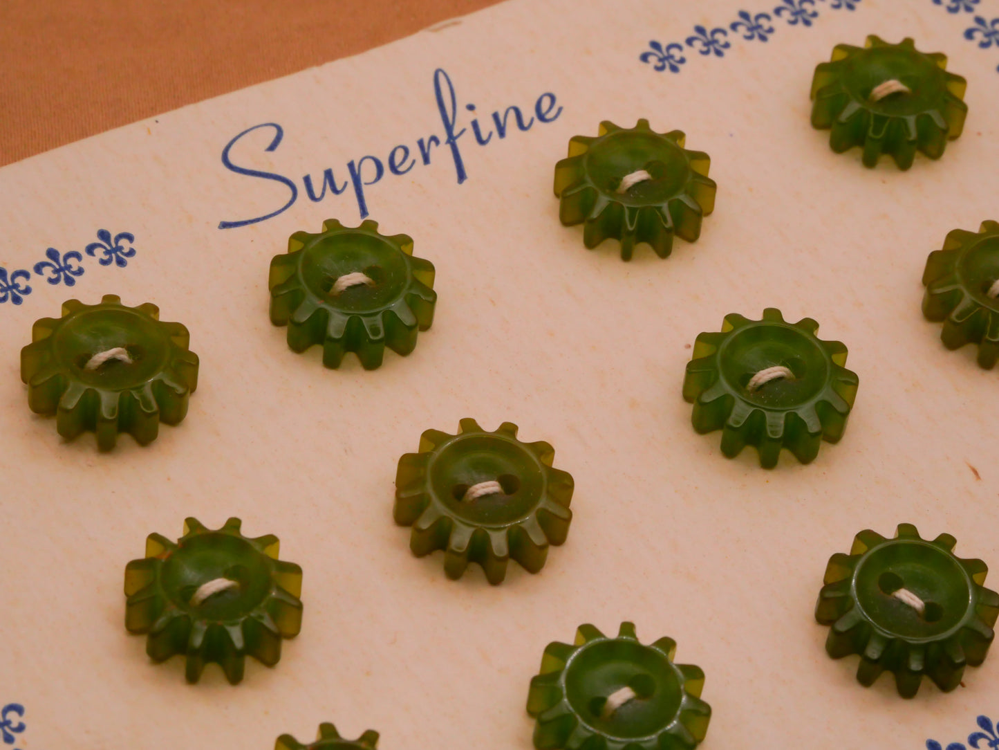 Gears Spokes Green Early Plastic Carded Set of Twelve Buttons 12mm
