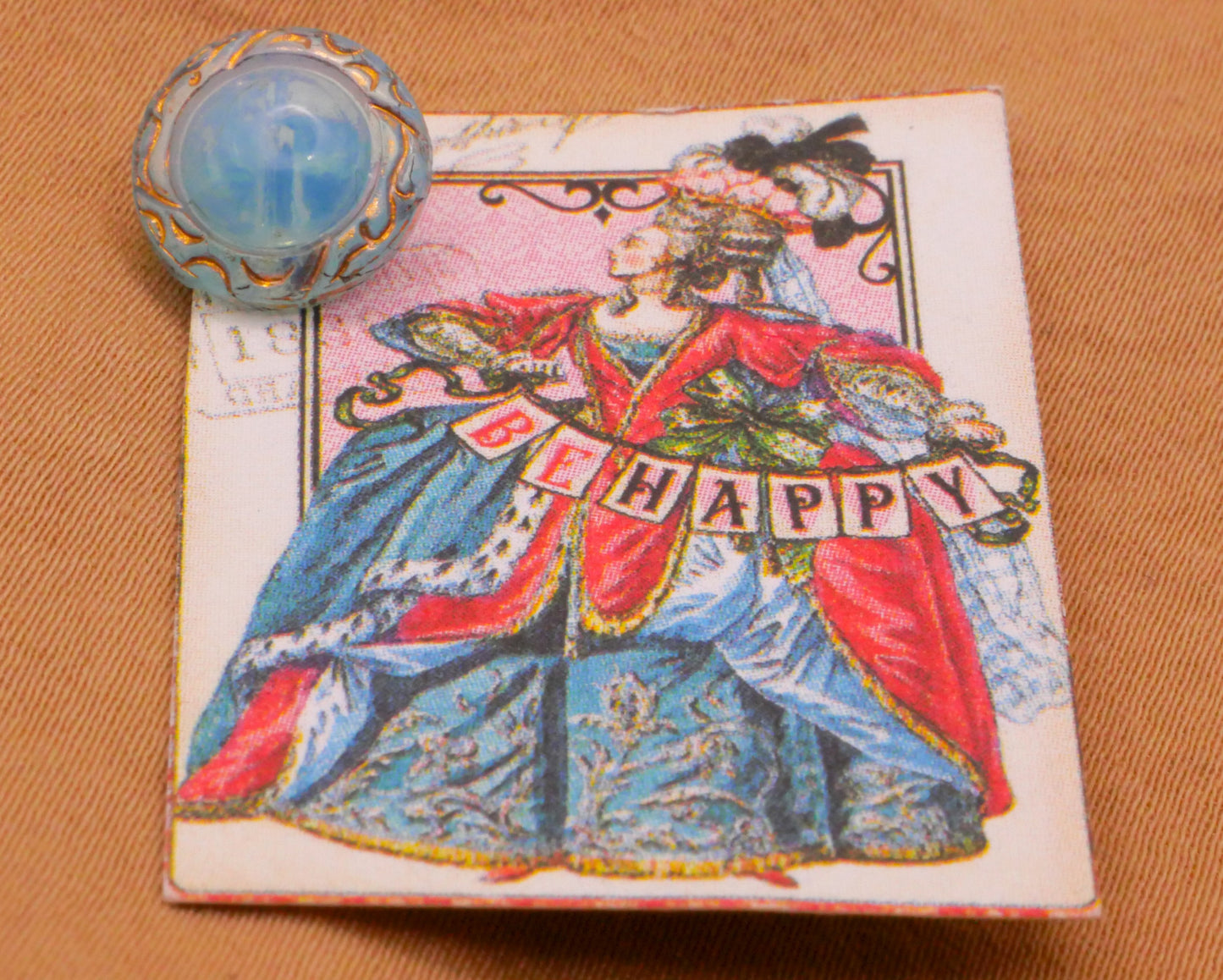 Queen Be Happy Aqua Blue Glass Carded Button 10mm